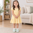 Five-year-old Sara model wearing mint green bunny slippers