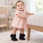 Sara wearing black baby side-bow booties